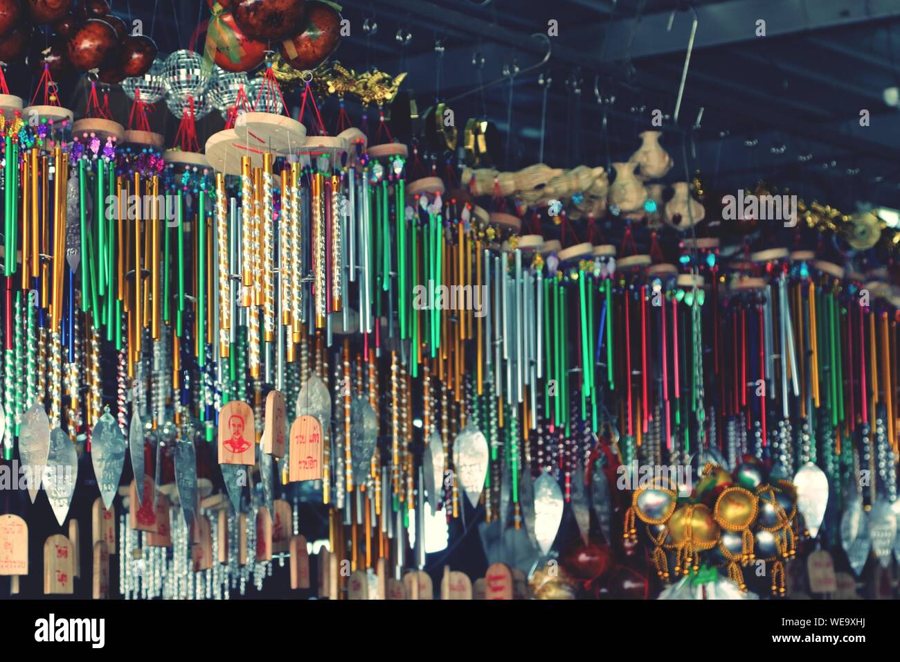 Various Wind Chimes Hanging For Sale At Market Stall Stock Photo
