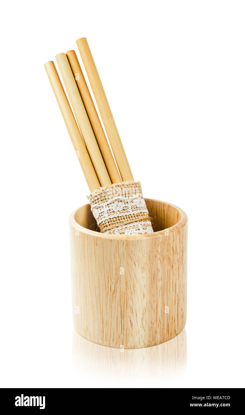 Biodegradable bamboo straws with wooden glass isolated on white