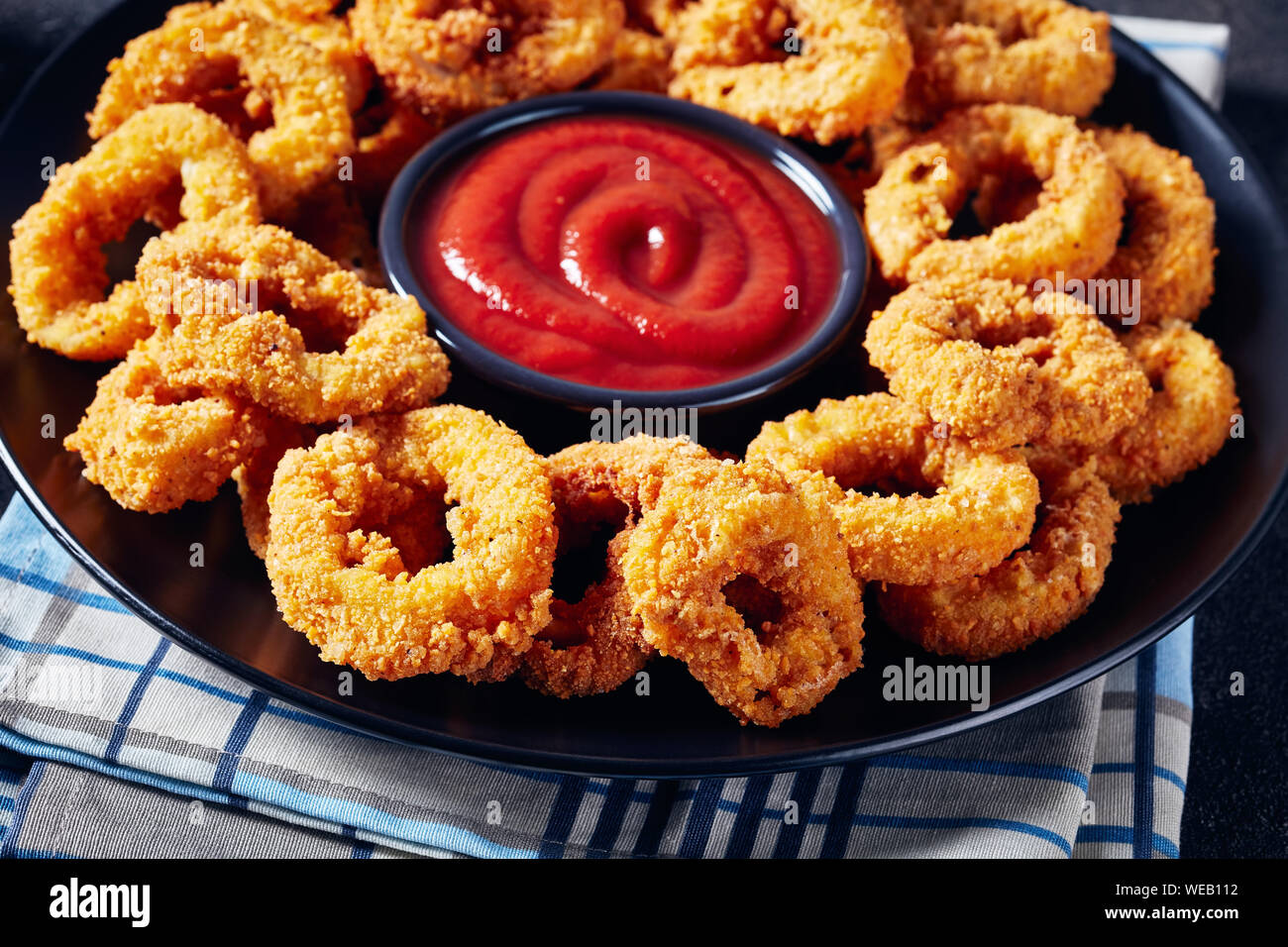 Fried squid rings breaded with lemon Stock Photo by ©koss13 60086227