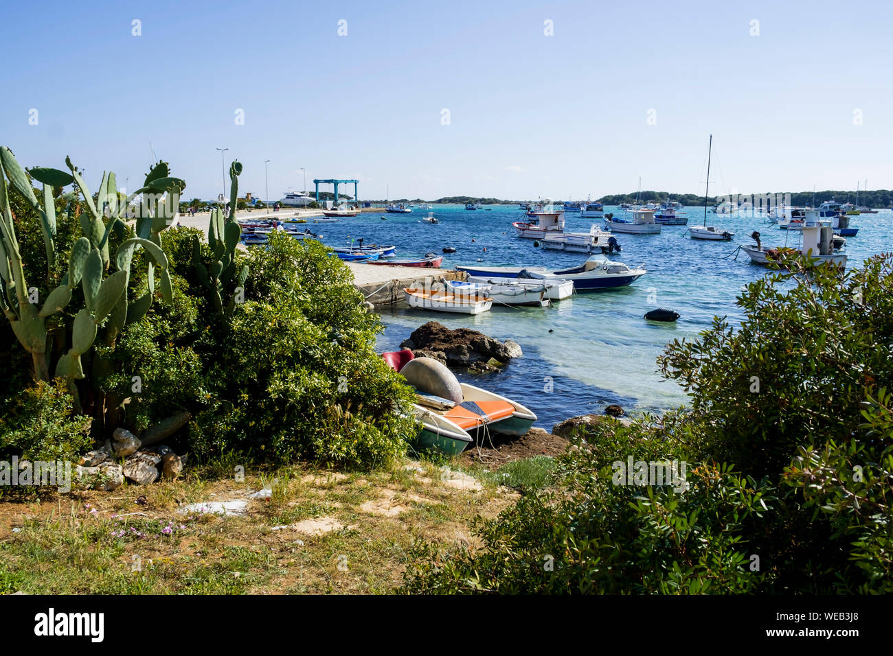 Scenic View Of Porto Cesareo Beach Against Clear Sky Stock Photo