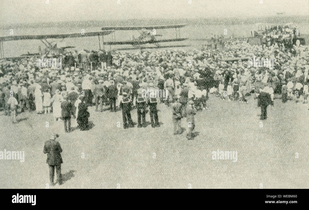 These photos dates to 1924. The caption reads: The First Men to Fly Around the World. In the upper picture is shown the return of the United States Army aviators to San Diego, Calif., September 22, 1924, after their world-girdling flight. Their total flying time was 375 hours 11 minutes. Below are the navigators of the three successful planes, Lieutenants Wade, Arnold, Smith, Ogden, Nelson, and Harding. Stock Photo