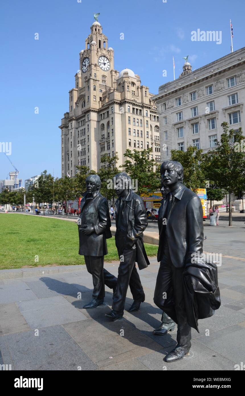 Statue of The Beatles by Andrew Edwards in front of Liver Building on