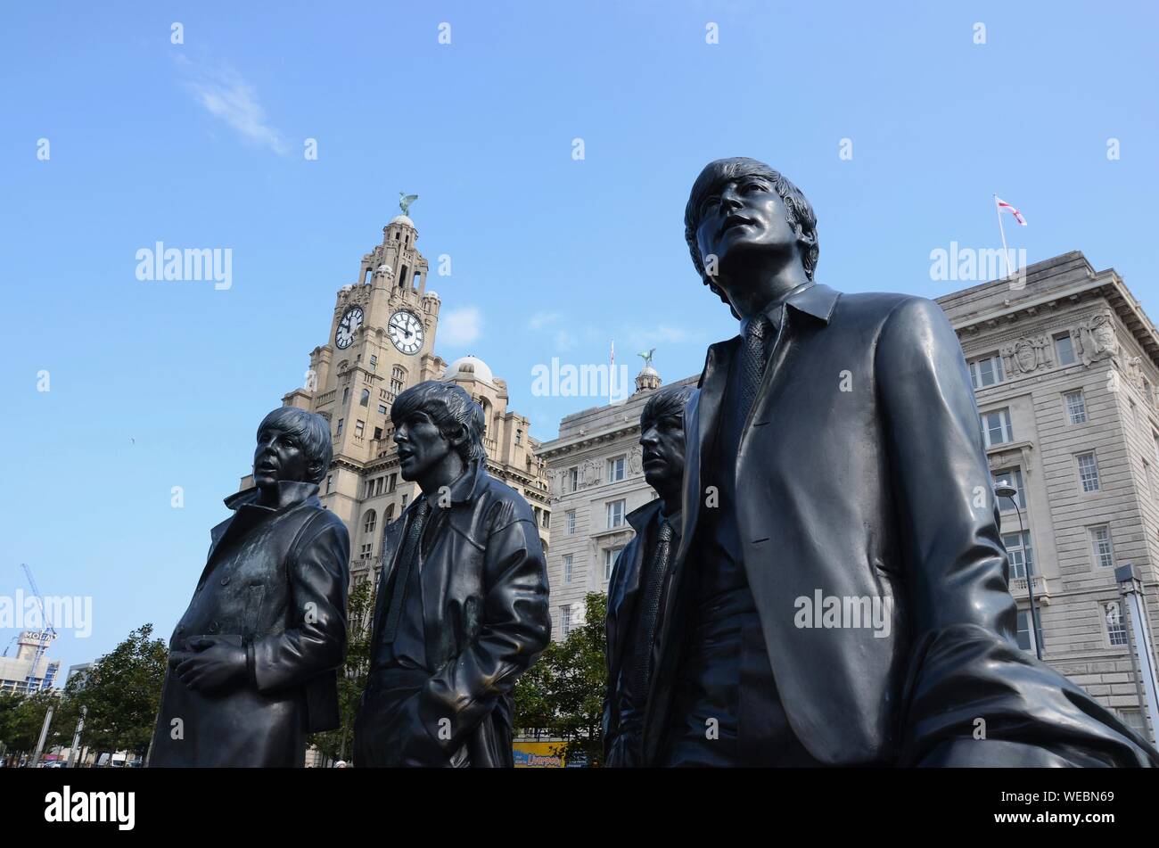 Statue of The Beatles by Andrew Edwards in front of Liver Building on