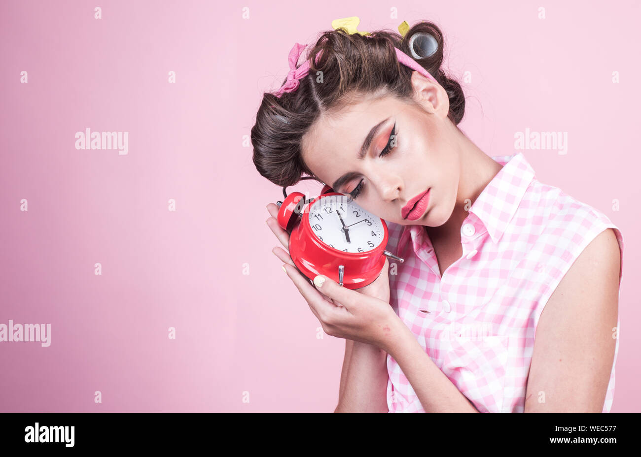 pinup girl with fashion hair. pin up woman with trendy makeup. good morning.  time management. retro woman with alarm clock. Time. sleepy tired girl in  Stock Photo - Alamy