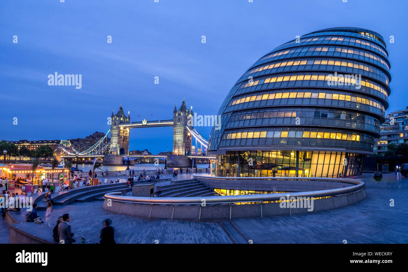 London City Hall and Tower Bridge on August 1, 2017 in London UK. The City Hall has an unusual bulbous shape was designed by Norman Foster and opened Stock Photo