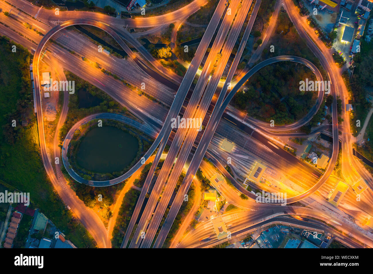 Aerial View Above of Busy Highway Road Junctions at day. The Intersecting Freeway Road Overpass The Eastern Outer Ring Road of Bangkok. Stock Photo