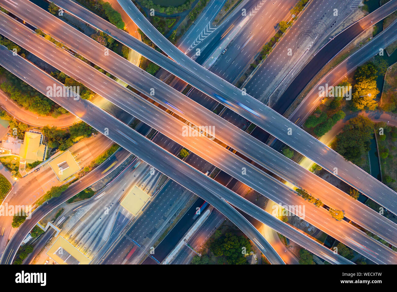 Aerial View Above of Busy Highway Road Junctions at day. The Intersecting Freeway Road Overpass The Eastern Outer Ring Road of Bangkok. Stock Photo