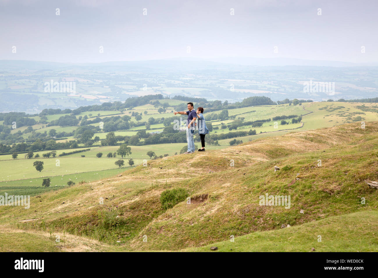 Couple Looking at View from Hay Bluff, Breacon Beacons, Wales, UK Stock Photo