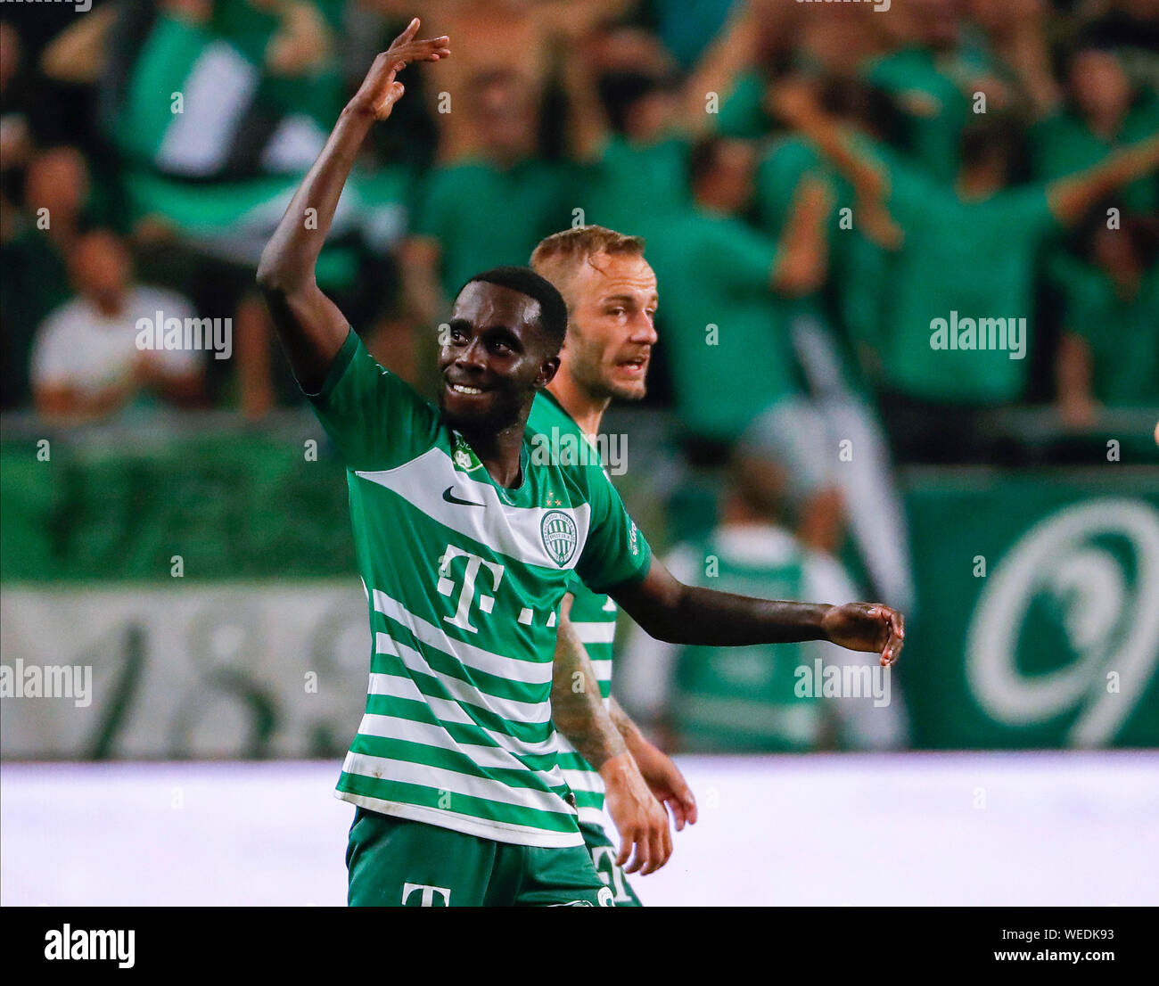 BUDAPEST, HUNGARY - AUGUST 29: (l-r) Tokmac Chol Nguen of Ferencvarosi TC  celebrates his goal in front of Gergo Lovrencsics of Ferencvarosi TC during  the UEFA Europa League Play-off Second Leg match