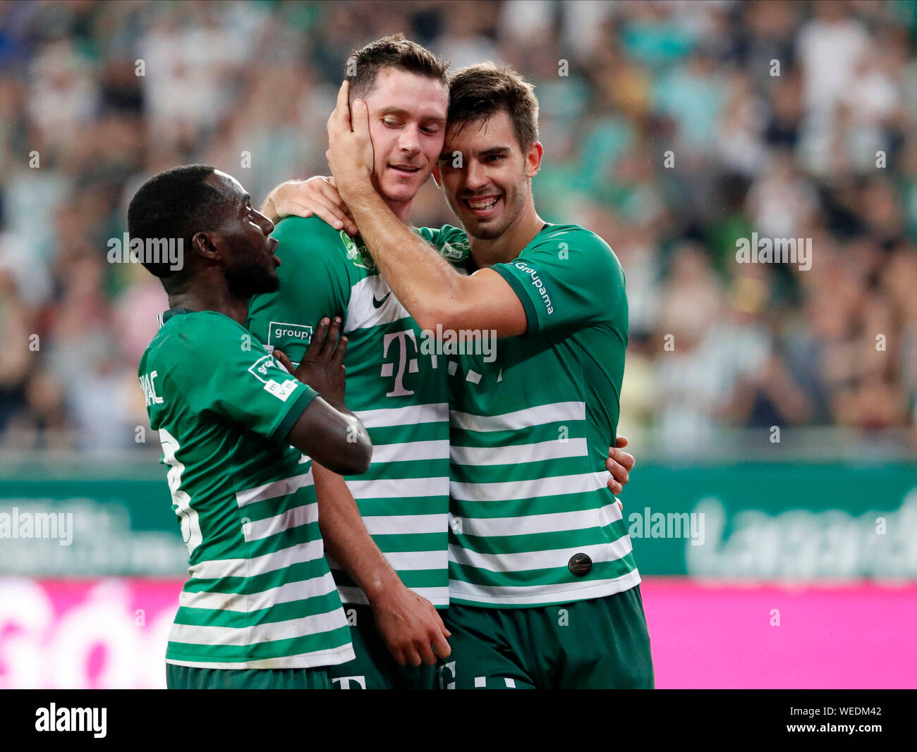 BUDAPEST, HUNGARY - AUGUST 29: (l-r) Tokmac Chol Nguen of Ferencvarosi TC  celebrates his goal in front of Gergo Lovrencsics of Ferencvarosi TC during  the UEFA Europa League Play-off Second Leg match