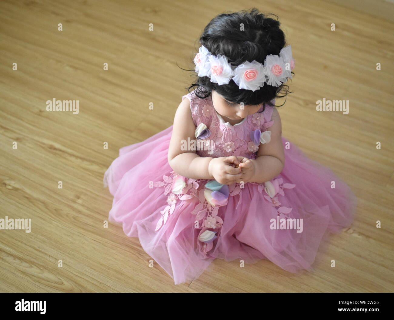 Cute baby girl in pink princess dress Stock Photo