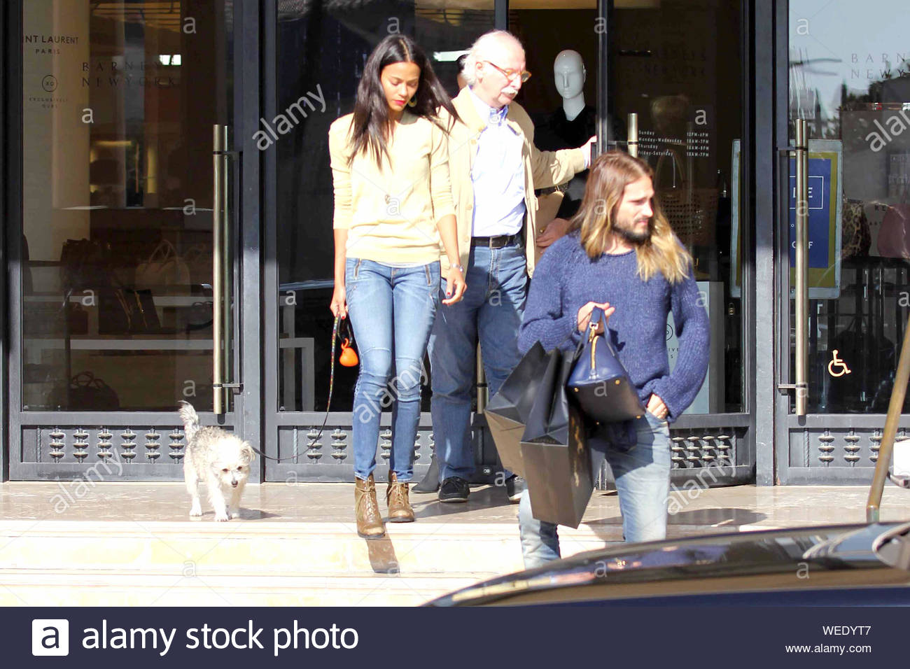 Beverly Hills, CA - Zoe Saldana and her husband Marco Perego finish up some  Christmas shopping at