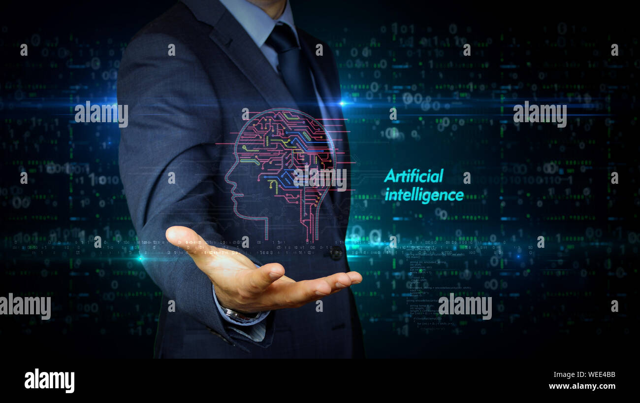 A businessman in a suit touch the screen with artificial intelligence hologram. Man using hand on virtual display interface. Cybernetic brain, deep le Stock Photo