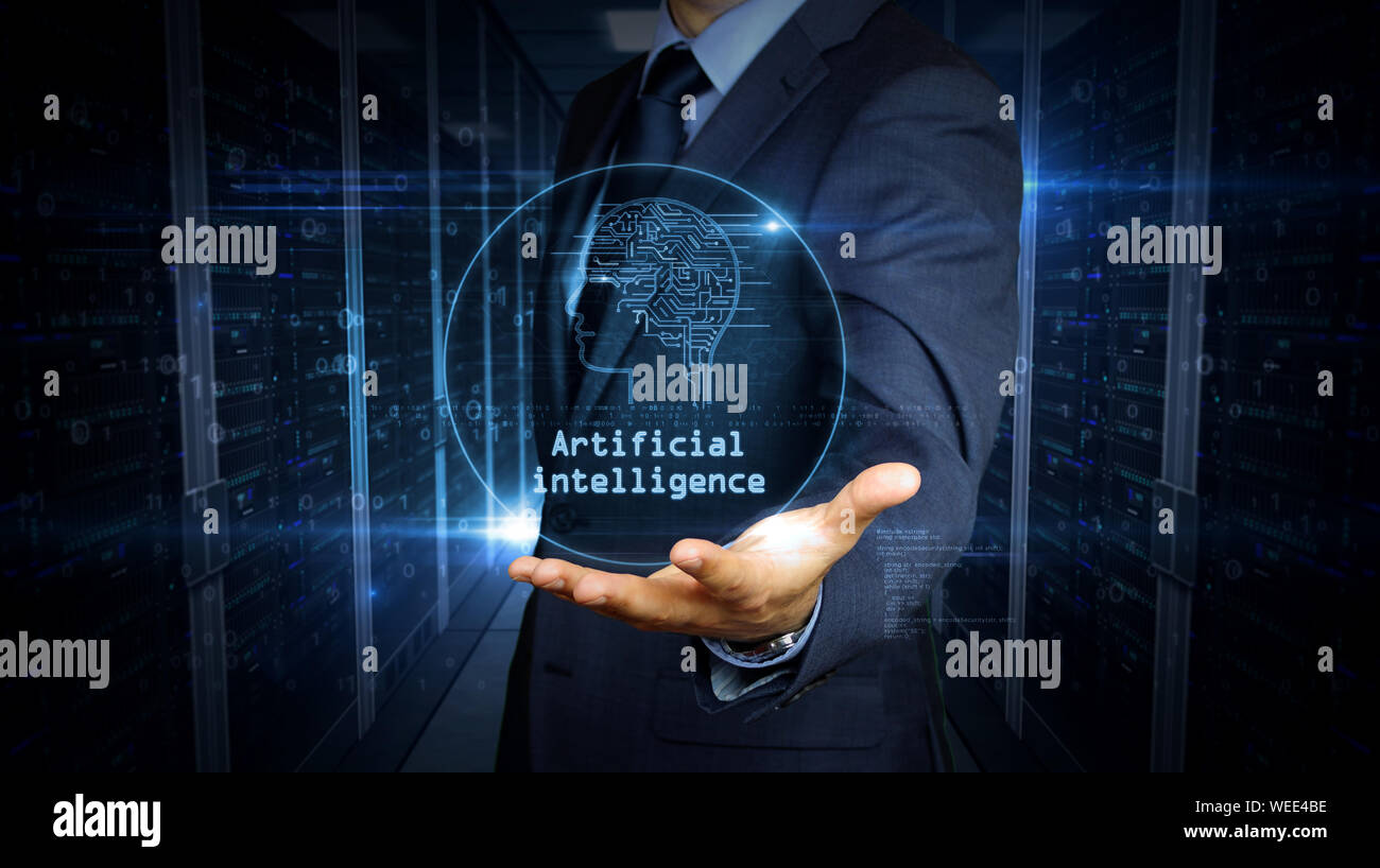 A businessman in a suit touch the screen with artificial intelligence hologram. Man using hand on virtual display interface. Cybernetic brain, deep le Stock Photo
