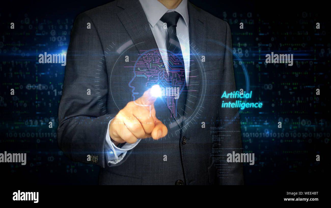 A businessman in a suit touch the screen with artificial intelligence hologram. Man using hand on virtual display interface. Cybernetic brain, deep le Stock Photo