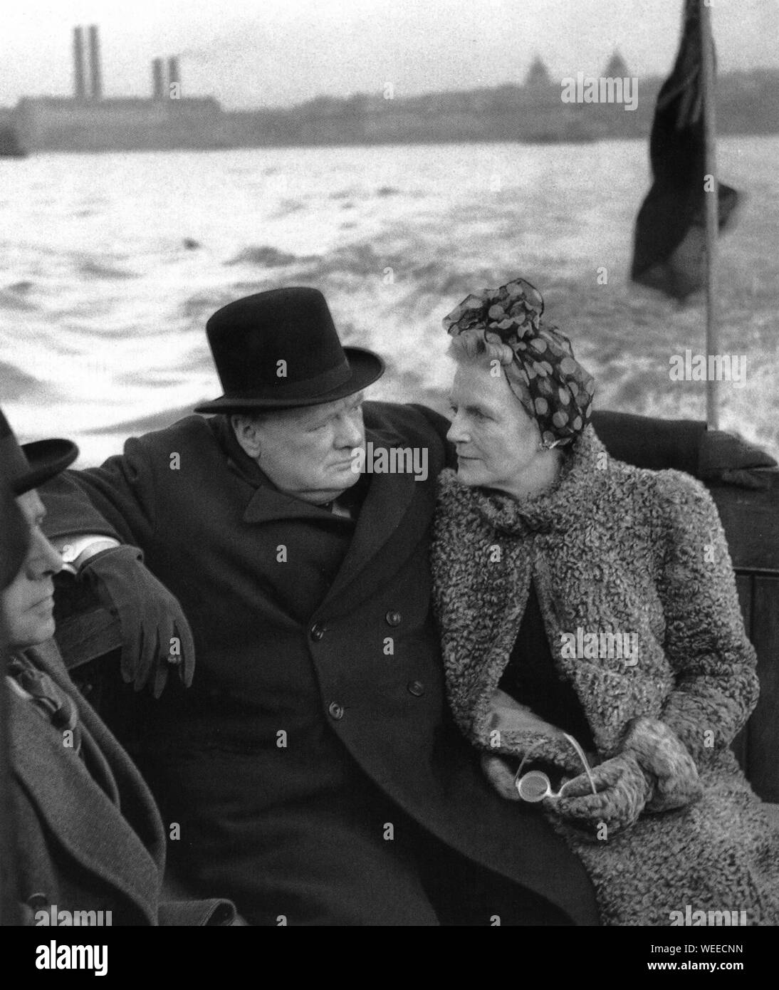 Winston Churchill with his wife Clementine inspect bomb damage from a launch on the Thames. 25th September 1940 Stock Photo
