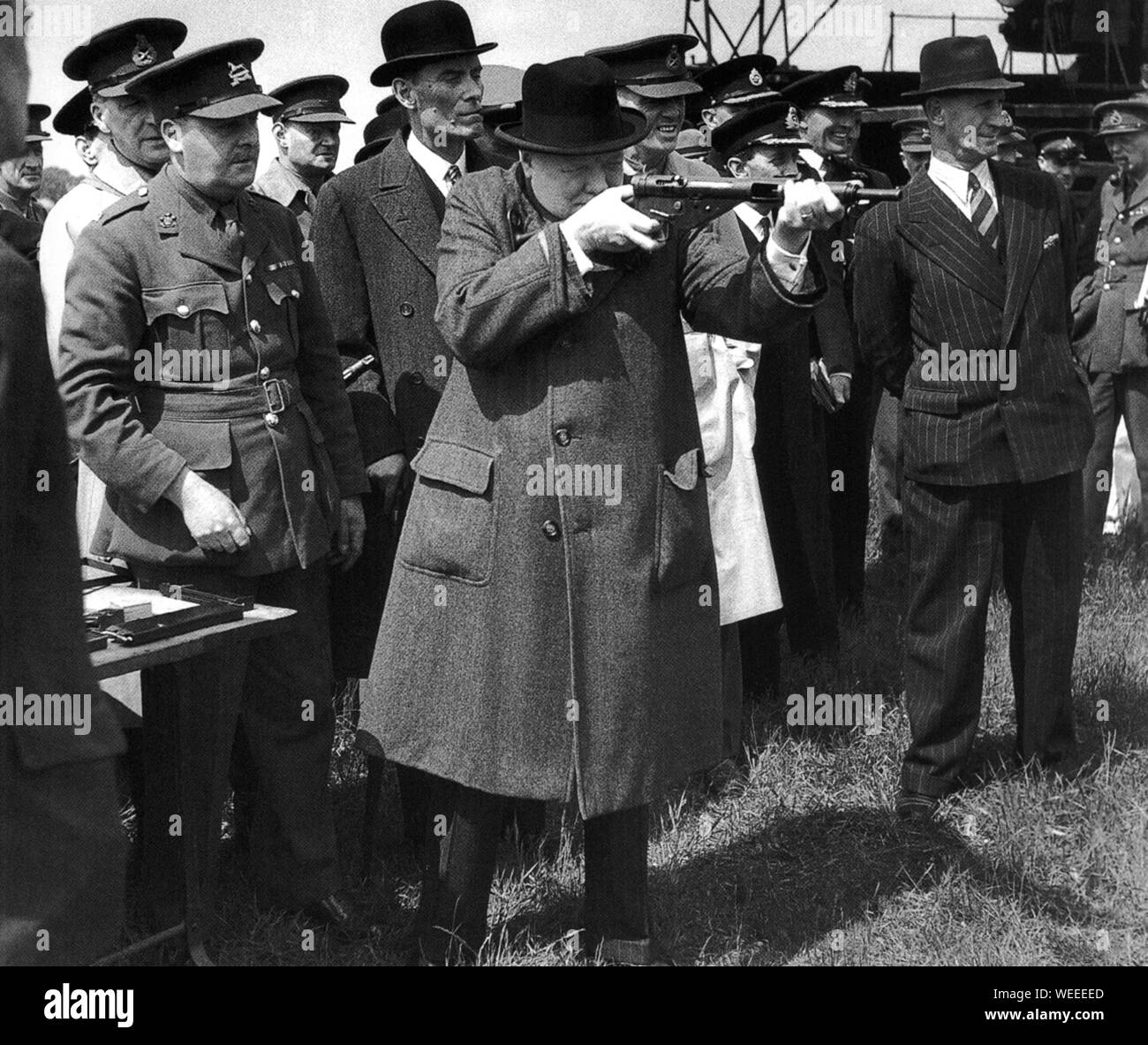 Winston Churchill tests the  new Sten submachine gun. June 1941. Stock Photo