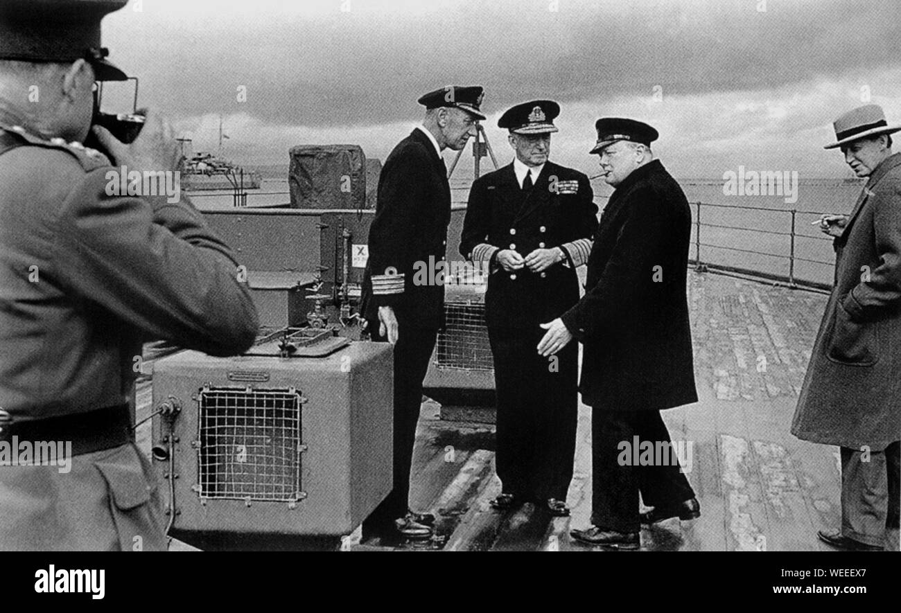 Winston Churchill aboard HMS Prince of Wales on visit to Newfoundland for meeting with President Roosevelt. August 1941.with Gen.Ismay,Hopkins,Pound Stock Photo