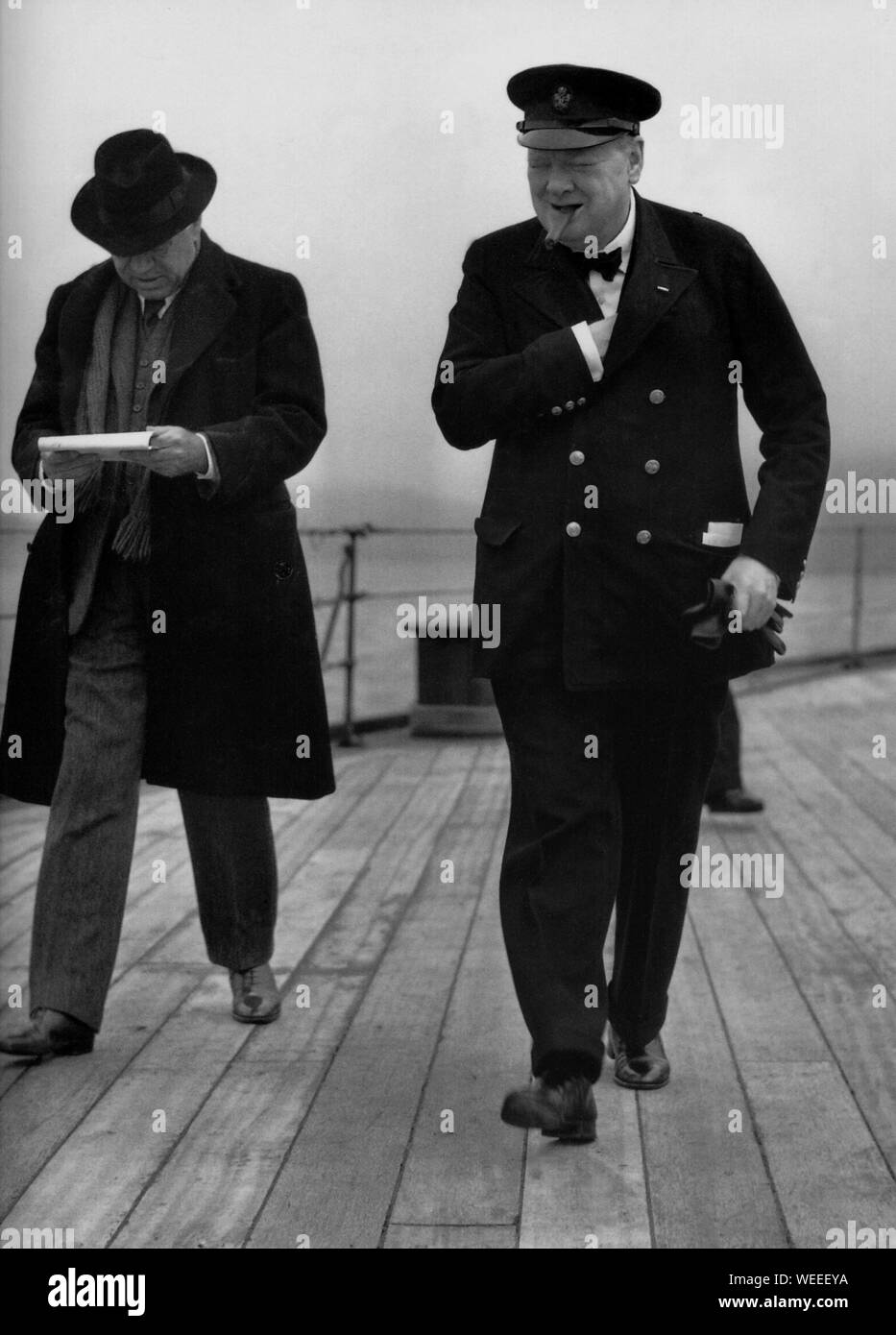 Winston Churchill aboard HMS Prince of Wales on visit to Newfoundland for meeting with President Roosevelt. August 1941.With Lord Beaverbrook Stock Photo