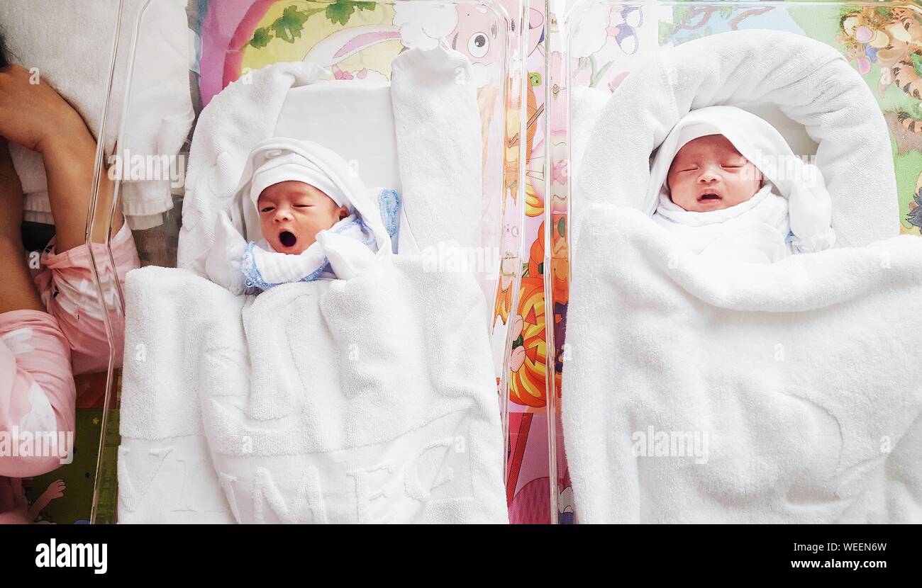 Family of three people sleeping in one bed hires stock photography and