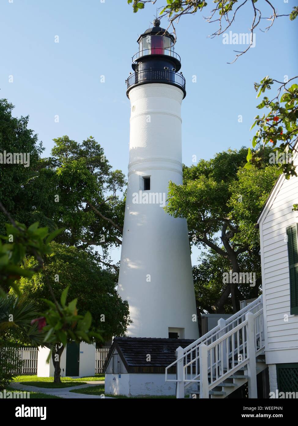 Medium close up of the Key West lighthouse, a historical attraction in