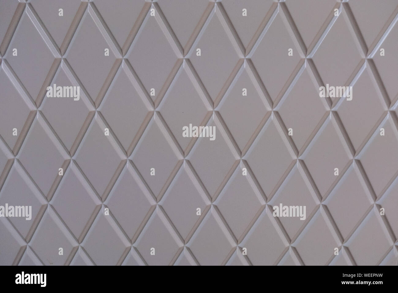 Abstract white geometric pattern with rhombuses. Stock Photo