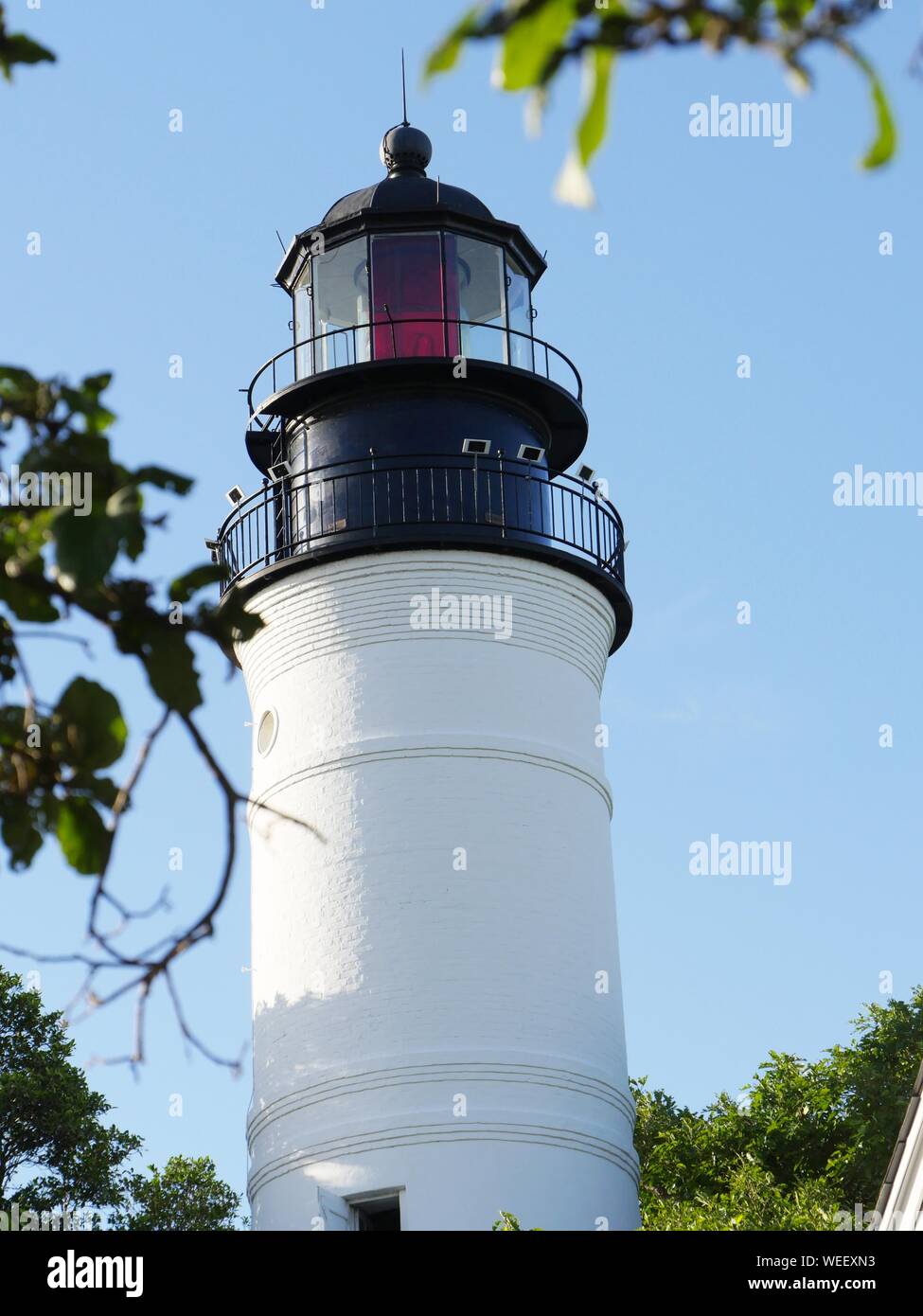 Portrait view of the upper half of the Key West lighthouse at Florida ...