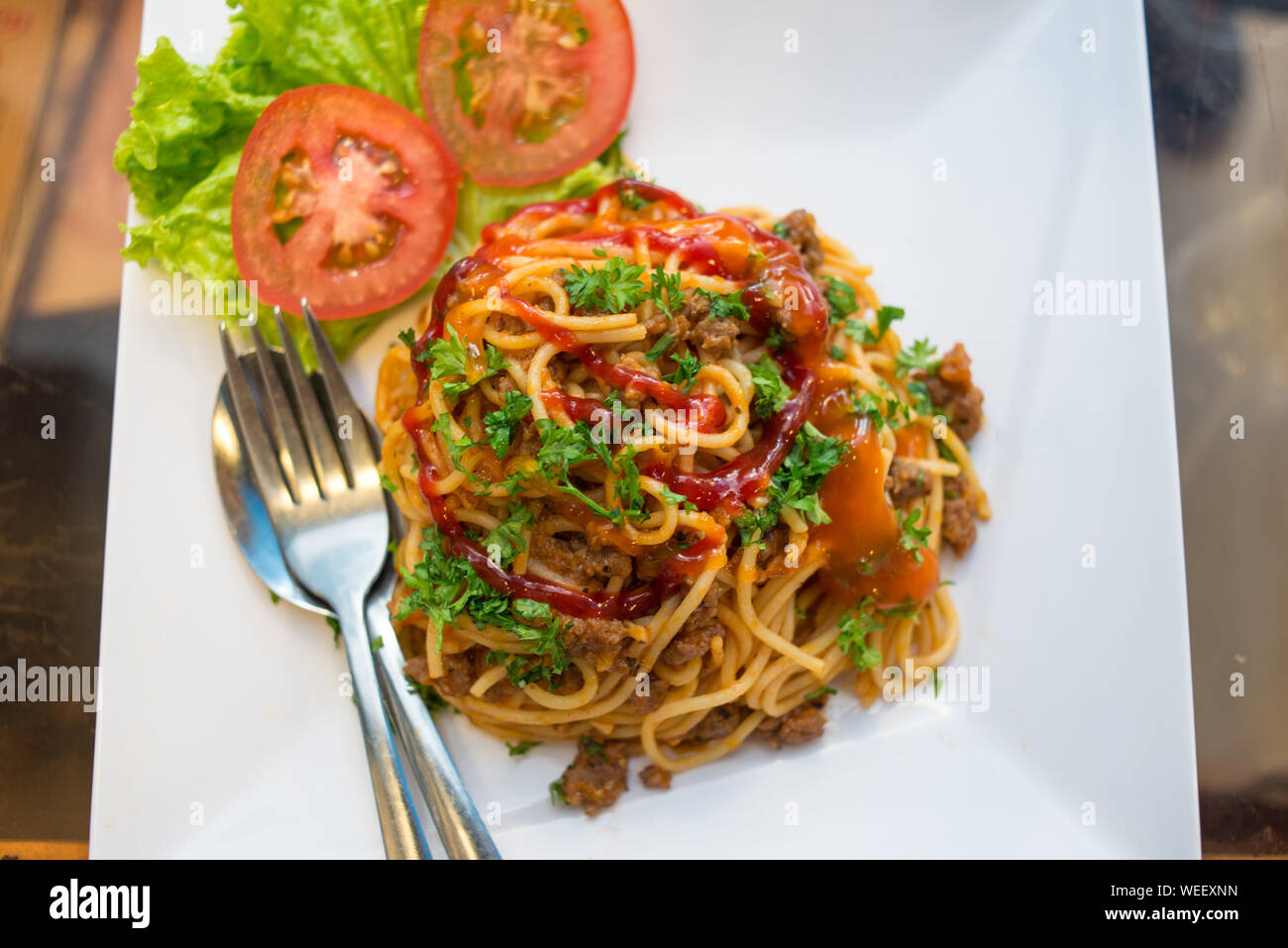 Delicious dish of meatballs spaghetti and vegetables with ketchup sauce
