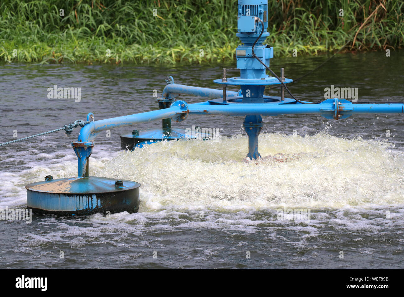 Water treatment by adding oxygen to the water using a propeller to hit