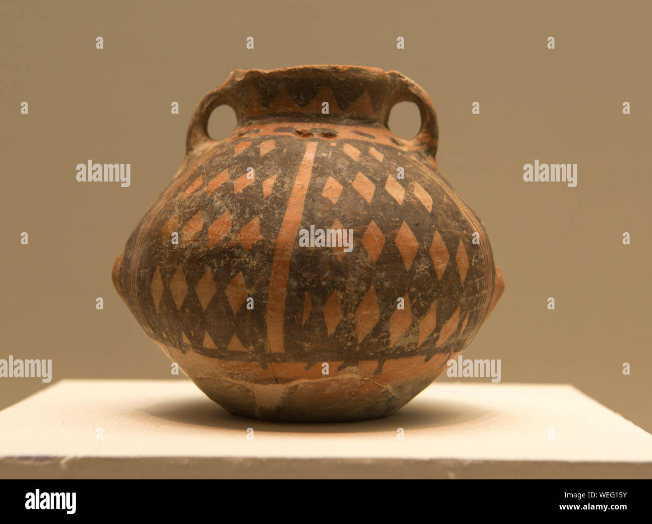 Colored pottery binaural jar. 3800 - 3600 years ago. The Xinjiang Uygur Autonomous Region Museum. Stock Photo