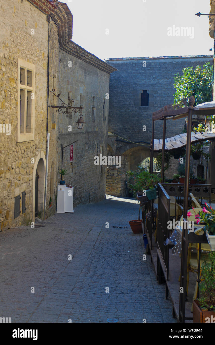 Restaurant in narrow cobblestone street of Carcassonne fortified city, France, Europe 2014. Stone citadel dating from 13th and 14th centuries Stock Photo