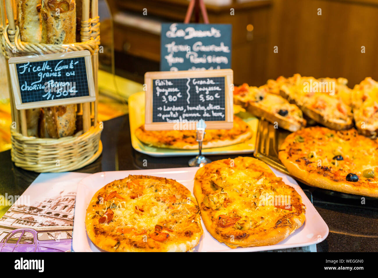 Quiches and baked goods in a bakery in Paris, France Stock Photo