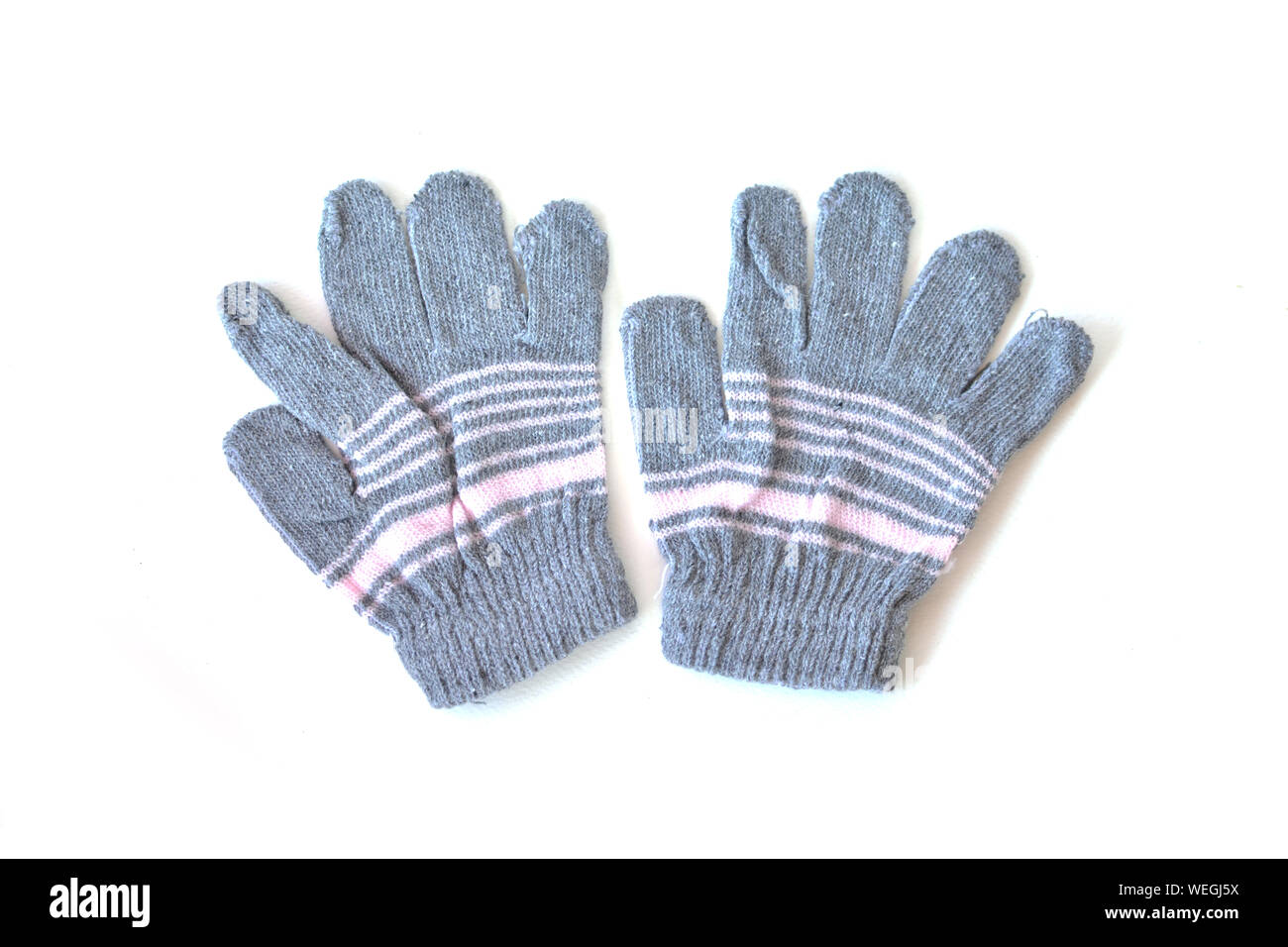 Directly Above Shot Of Woolen Gloves Over White Background Stock Photo