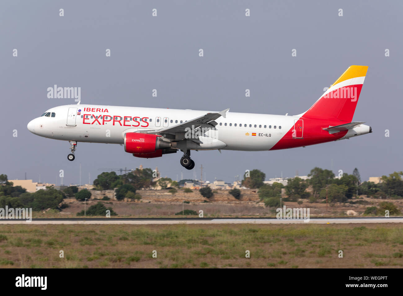 Iberia Express Airbus A320-214 (EC-ILQ) on finals runway 31. Stock Photo