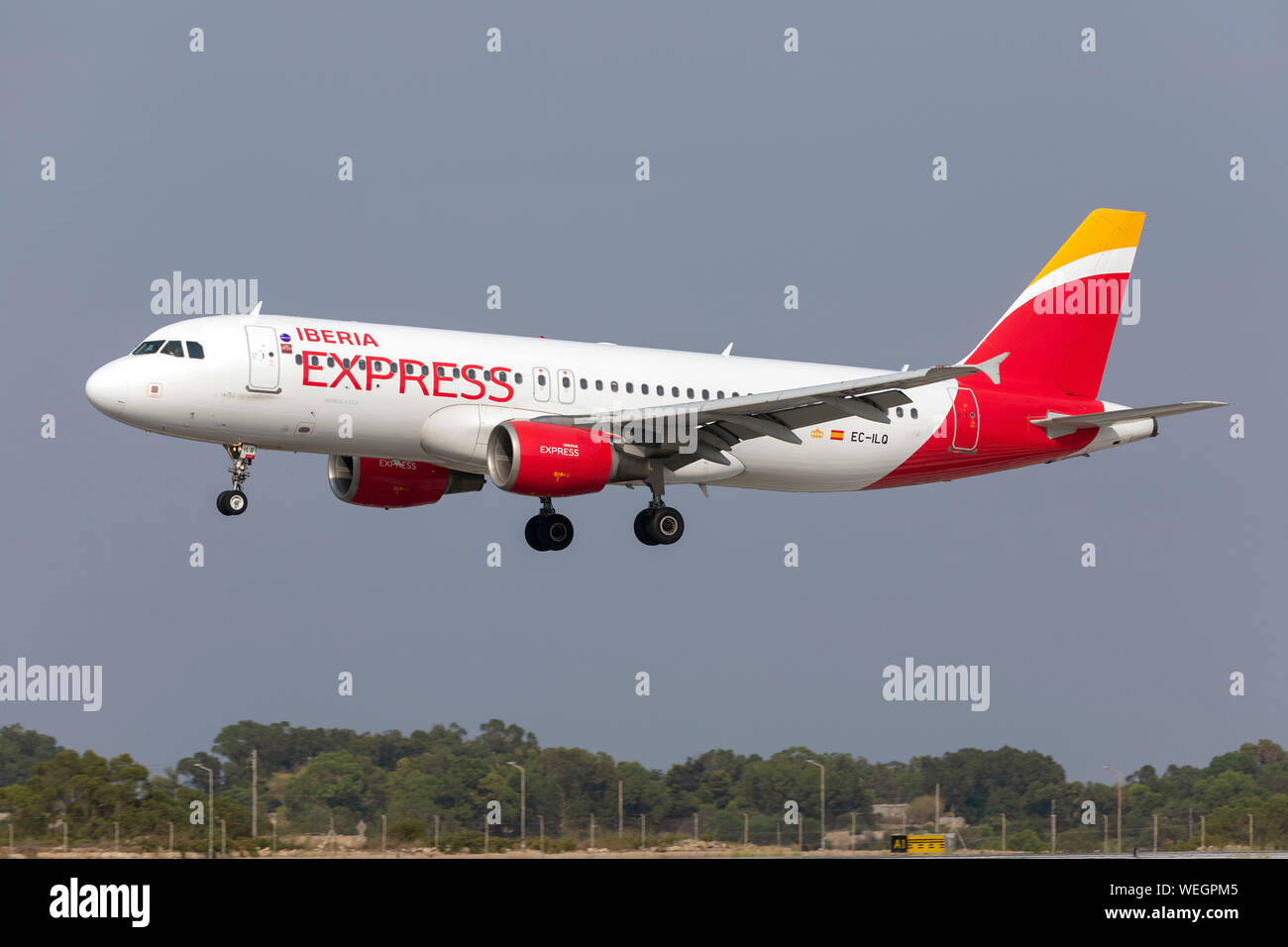 Iberia Express Airbus A320-214 (EC-ILQ) on finals runway 31. Stock Photo