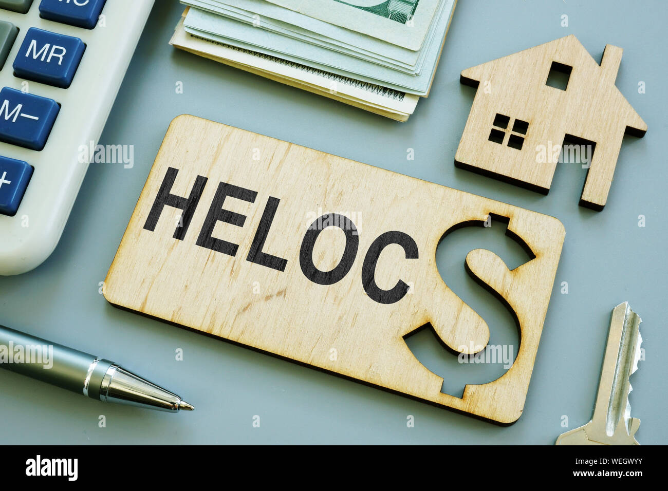 Wooden plank with sign HELOC Home Equity Line of Credit. Stock Photo