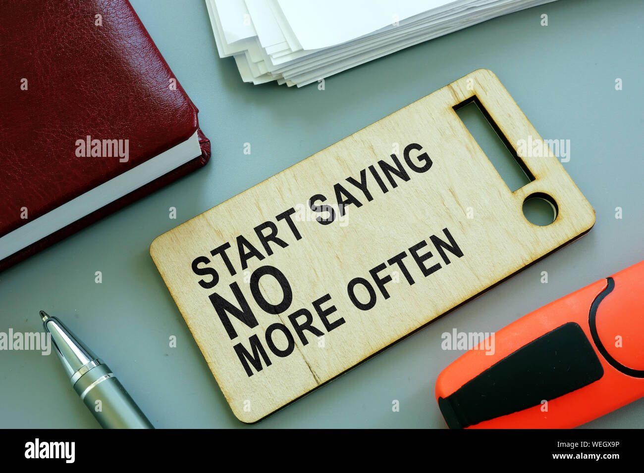 Start Saying No More Often sign on the plate. Stock Photo