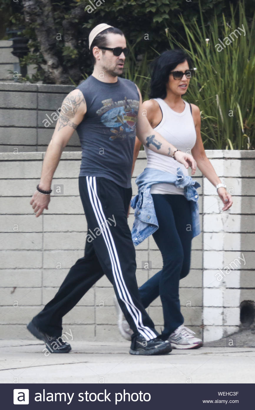 Los Angeles, CA - Irish actor Colin Farrell and his sister Claudine Farrell  go for an afternoon walk the neighborhood in Los Angeles. Colin showed off  his tattoos and fit body wearing
