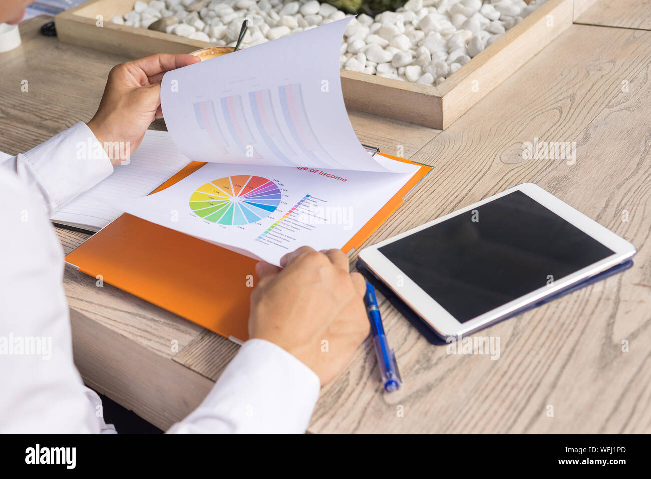 Businessman checking financial documents in the office Stock Photo