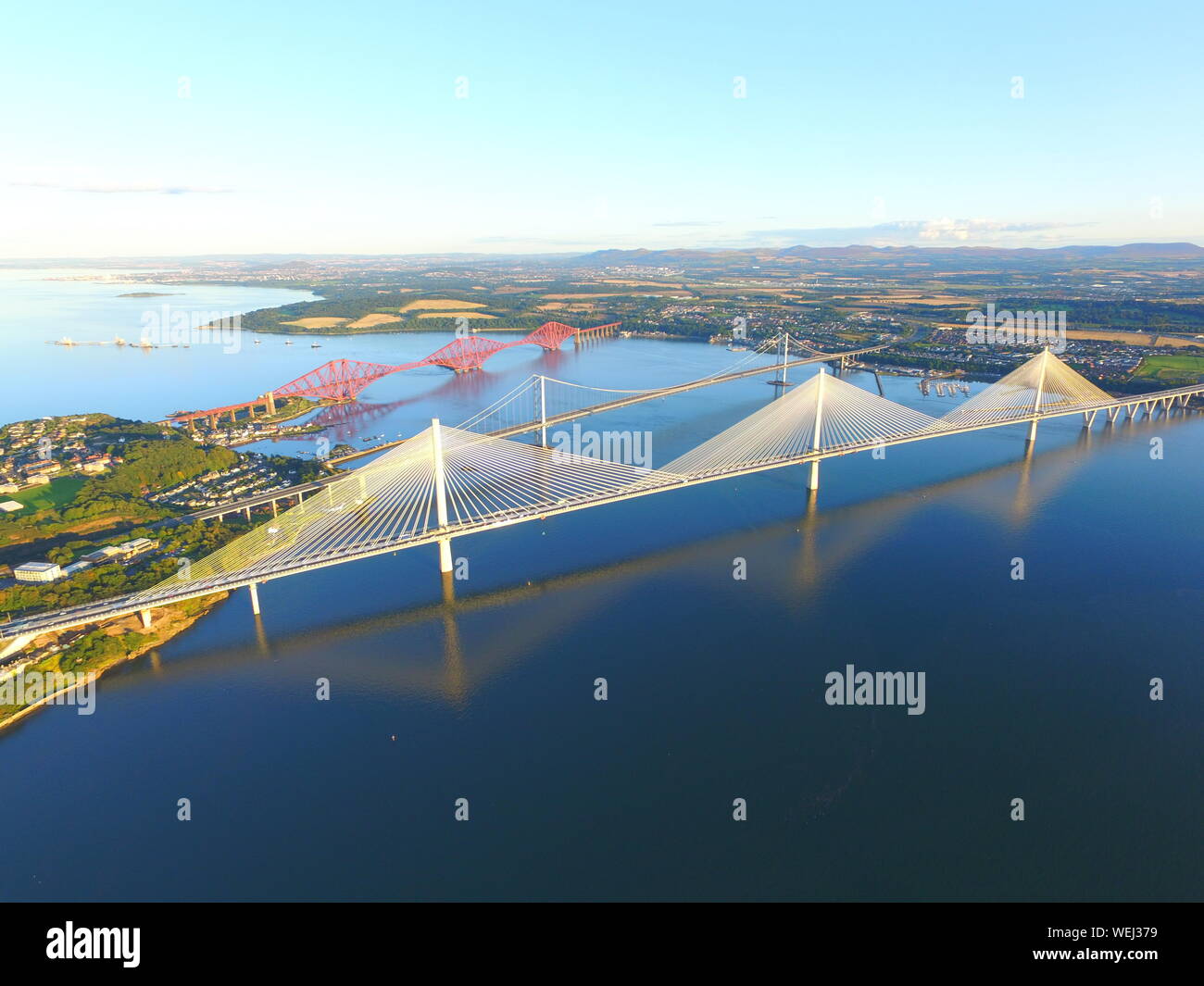 High Angle View Of Suspension Bridges Over Sea In City Stock Photo