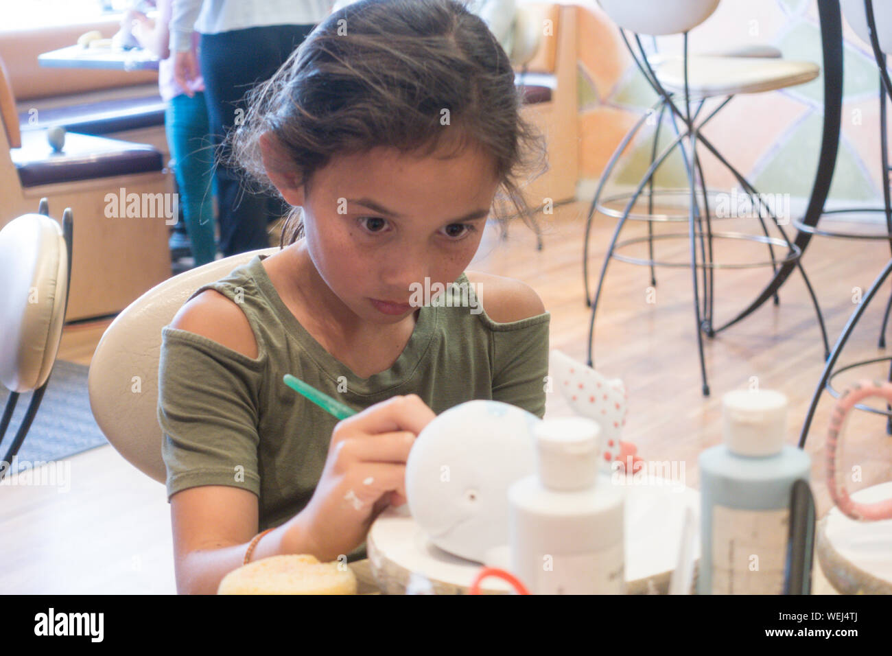 10 year old girl mixed ethnicity doing pottery, San Jose, California Stock Photo