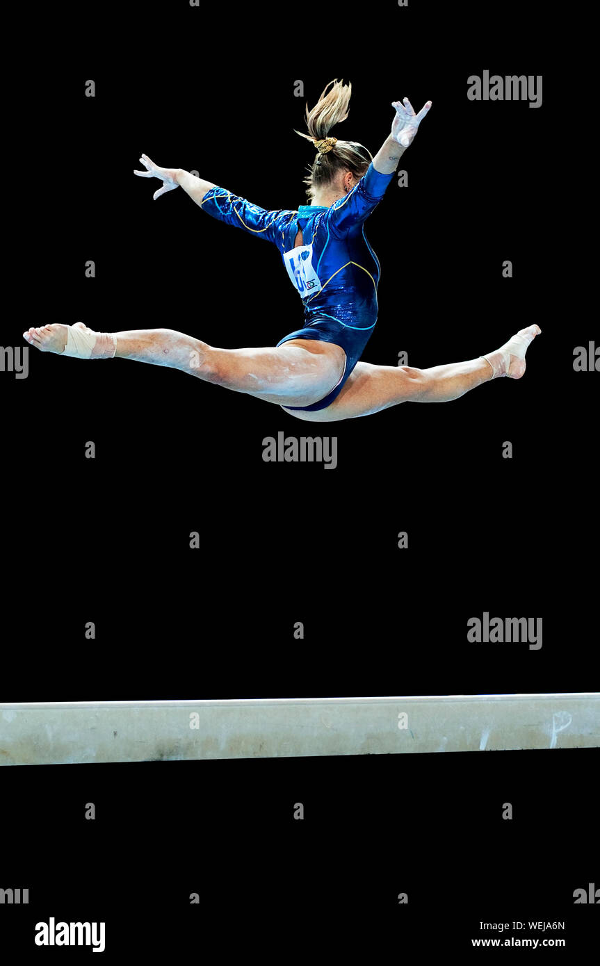 Gymnast during exercise on balance beam Stock Photo Alamy
