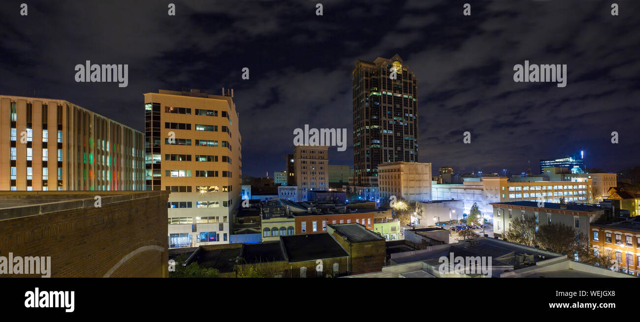 Panoramic rooftop shot of city skyline of Raleigh, North Carolina at night Stock Photo