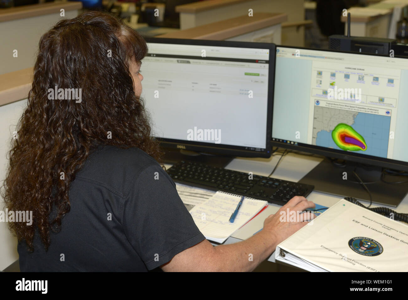 Melbourne, United States. 30th Aug, 2019. Team members from various organizations in Central Florida monitor the advance of Hurricane Dorian at the Brevard County Emergency Management Facility in Rockledge, Florida on Friday, August 30, 2019. A State of Emergency has been announced throughout most of the East Coast of Florida in preparation of the approaching storm. Dorian is anticipated to make landfall somewhere between Central and South Florida as a Category 4 Hurricane. Photo by Joe Marino/UPI Credit: UPI/Alamy Live News Stock Photo