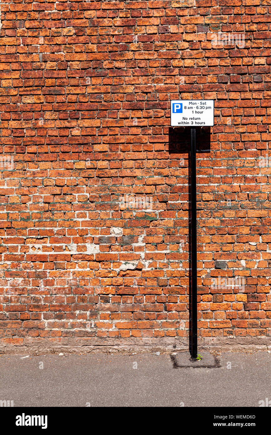 Old brick wall with white sign Stock Photo - Alamy