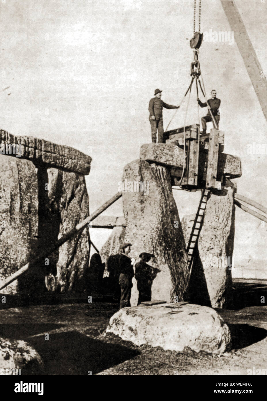 Stonehenge  - Repairs / reconstruction to the ancient Wiltshire  monument  .  Replacing a cross stone or lintel. One of the many repairs and reconstructions that have taken place between the 1920's and 1960's. Stock Photo