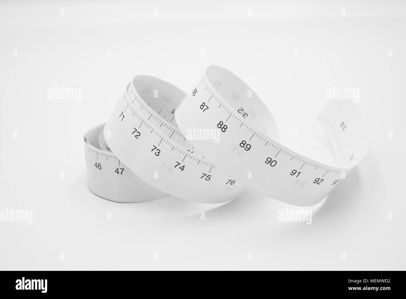 White measuring tape ruler metric measurement or diet concept isolated ...