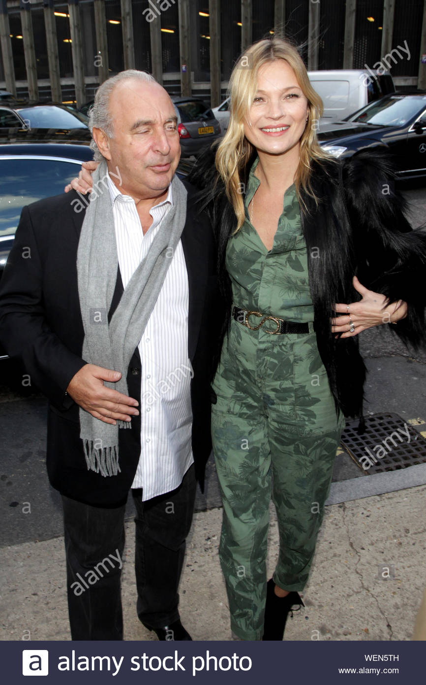 London, UK - Kate Moss attends the TopShop London Fashion Week show and  poses for photos with Sir Philip Green. Kate is looking good in a  camouflage one piece jumpsuit, with a