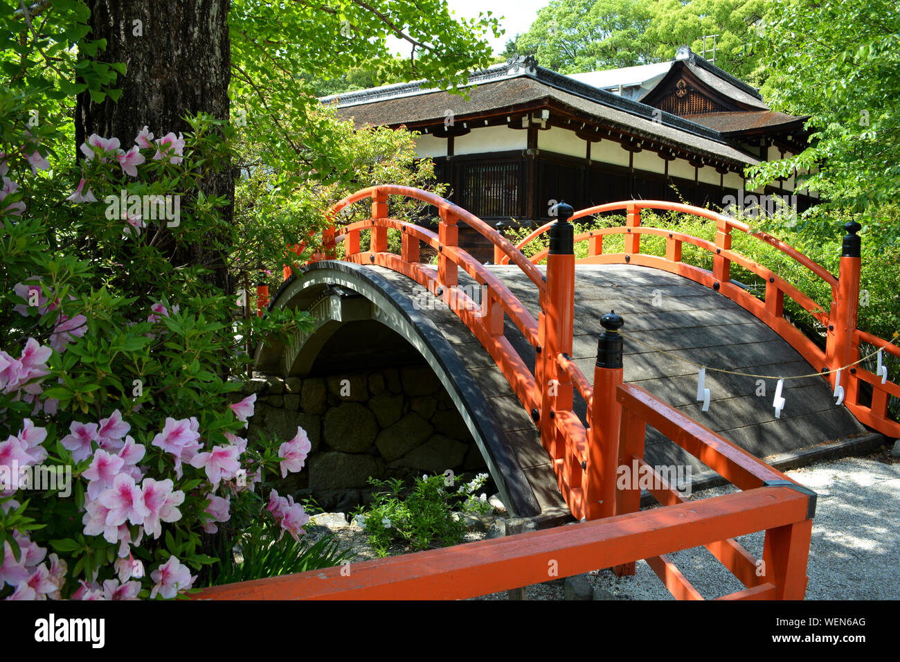 Red Japanese Shrine Bridge in Japanese Garden Stock Photo