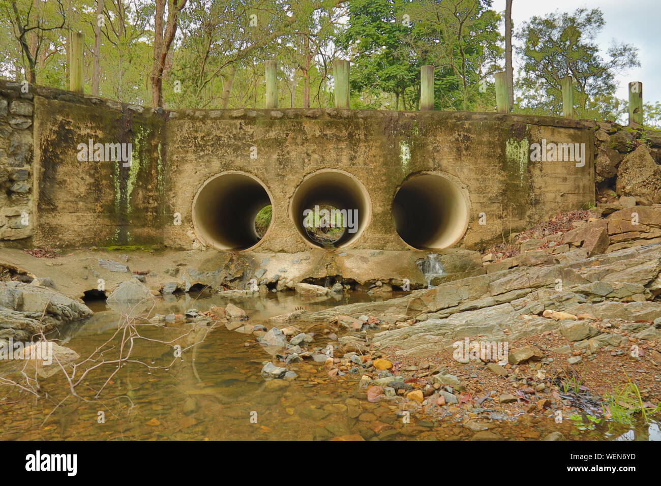 Sewage Pipes By Stream Stock Photo